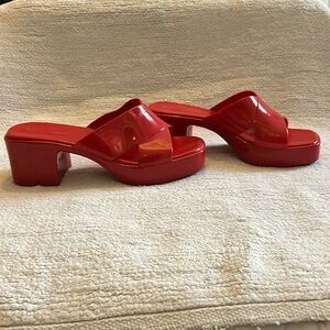 Jeffrey Campbell red platform jelly sandals.